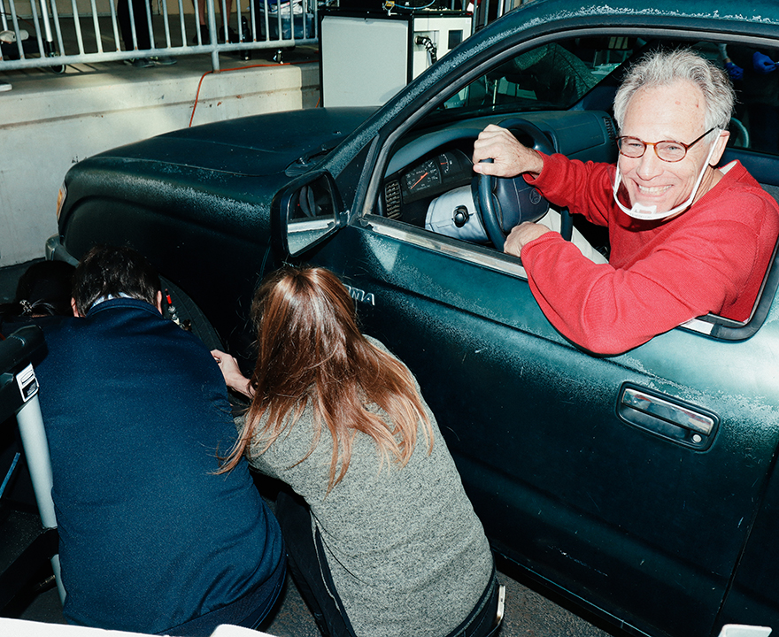 Don Blake, professor in the Rowland-Blake lab, Department of Chemistry, grins after peeling into Rowland Hall's loading dock, where fellow scientists huddled around his Toyota Tacoma's tires so they could take air samples. 