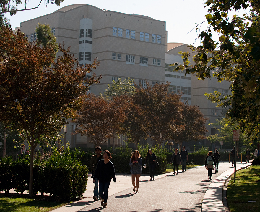 Campus buildings with students walking