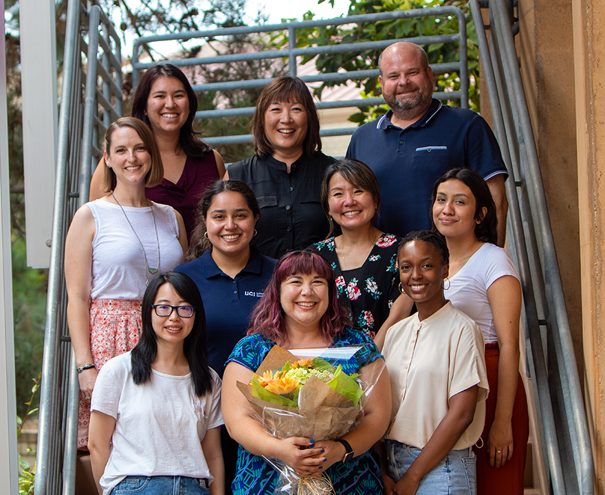 Undergraduate Student Affairs team surrounds Leinen award winner Estela Magana (holding flowers).