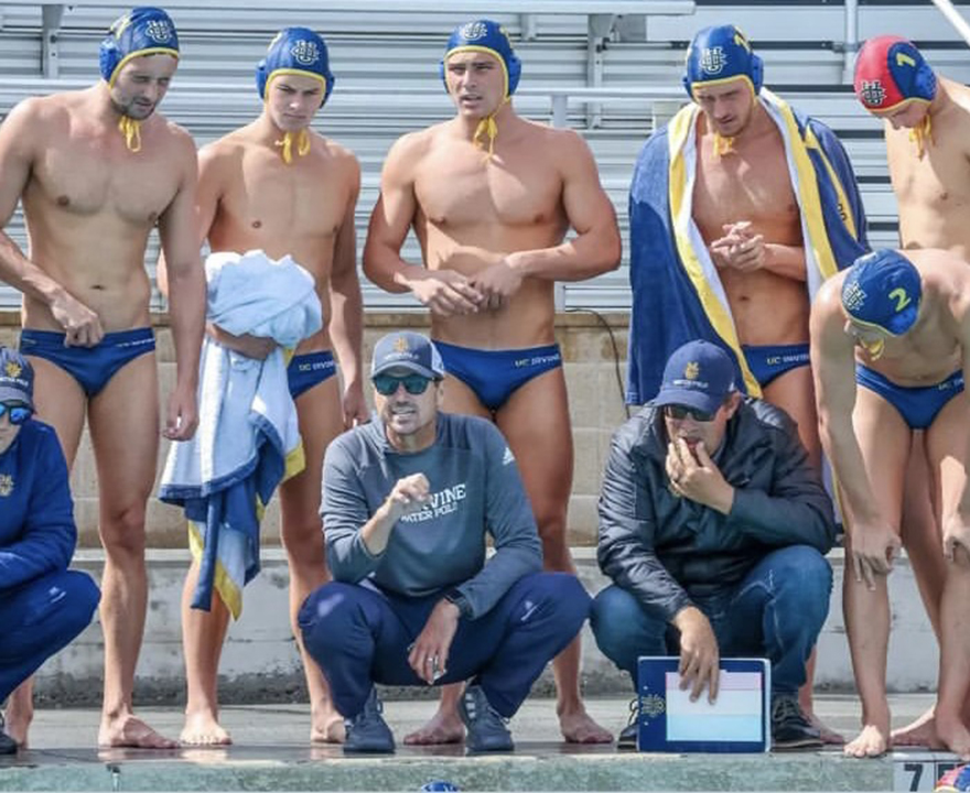 Mens Water Polo team beside the pool
