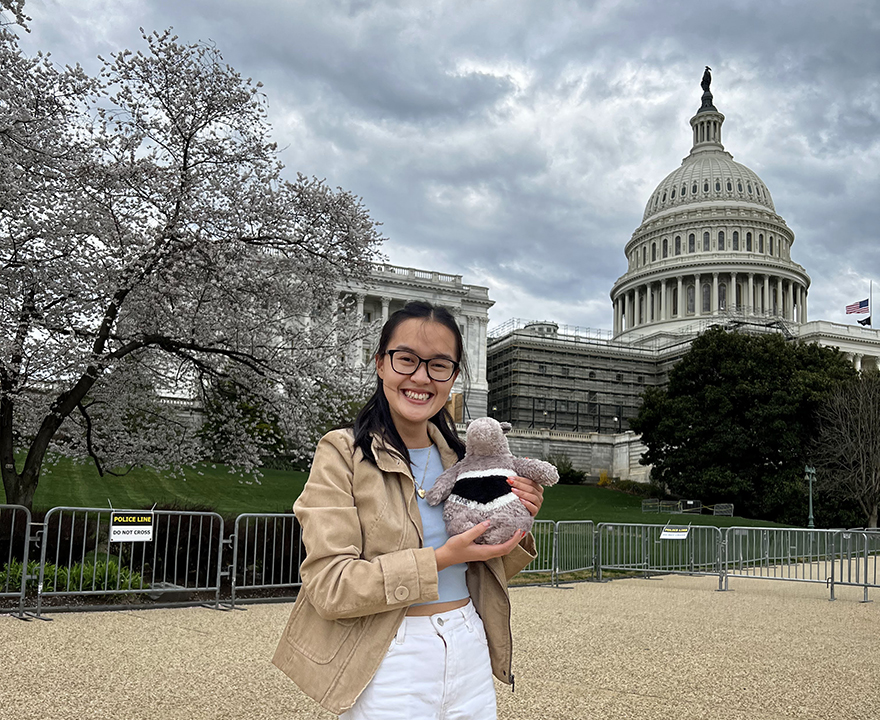 Michelle Truong '23 political science in DC outside the U.S. Capitol with Peter the Anteater