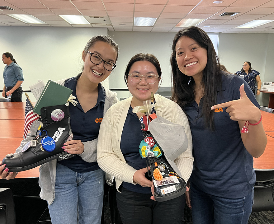 Michelle (left) poses with fellow Labor Summer interns Thi Le (urban studies '24) and Allysa Suhaidi (law '24) at their internship site, the Orange County Employee Association. 