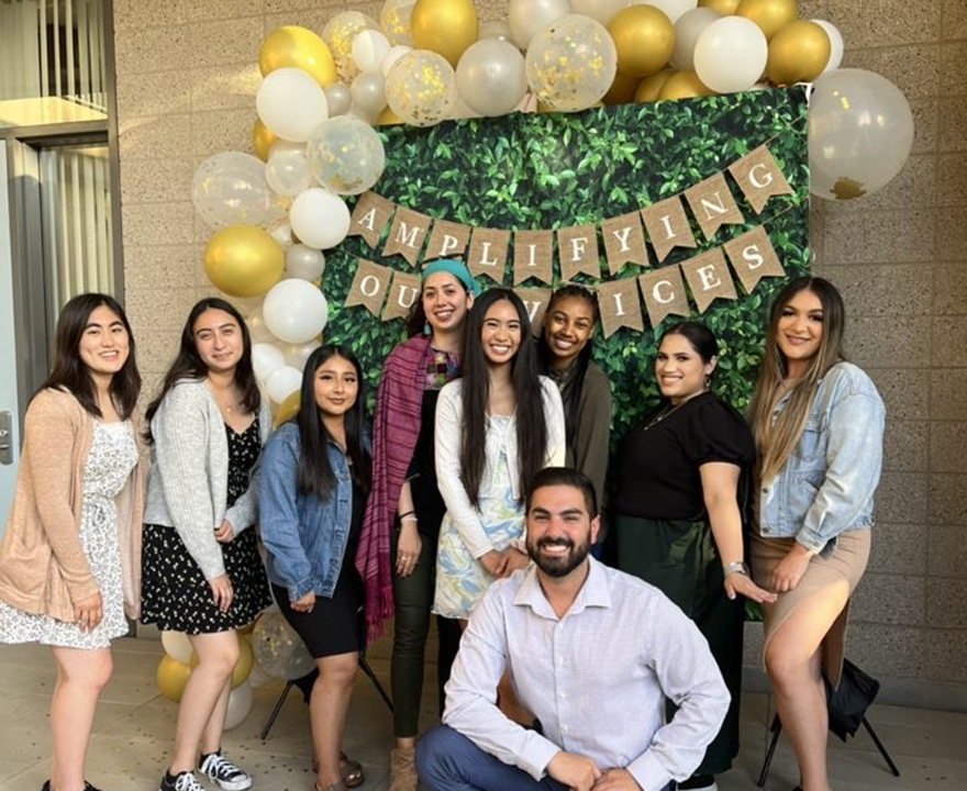 Valentina (in a pink shawl) at the SOAR End of Year Celebration with fellow Pathfinder Peer Educator Program mentors, courtesy of the Student Outreach and Retention (SOAR) Center.
