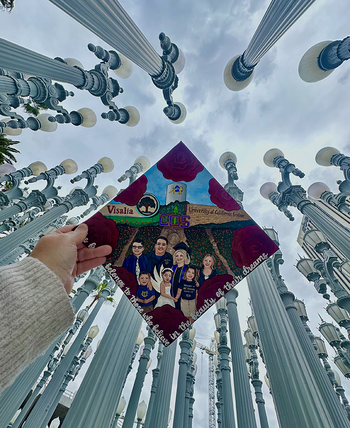 Michelle Story's commencement cap features her family