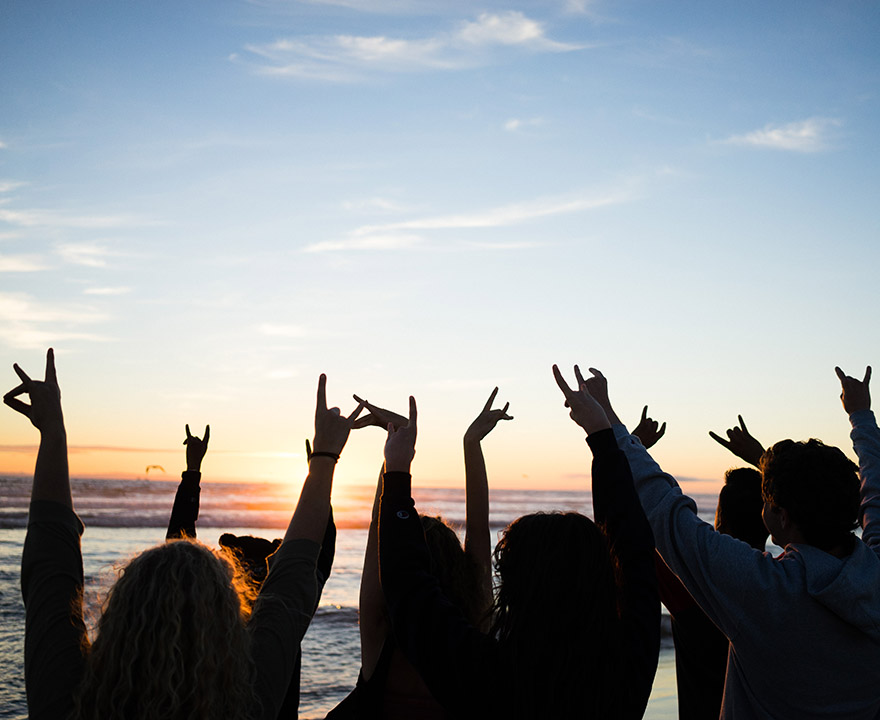 students zotting in the sunset