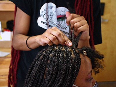 Akunna Ekeh getting her hair done